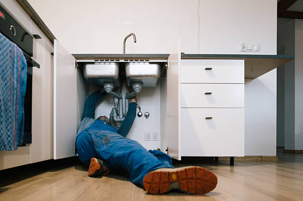 Professional Drain Cleaning technician working in Oldfield, MO